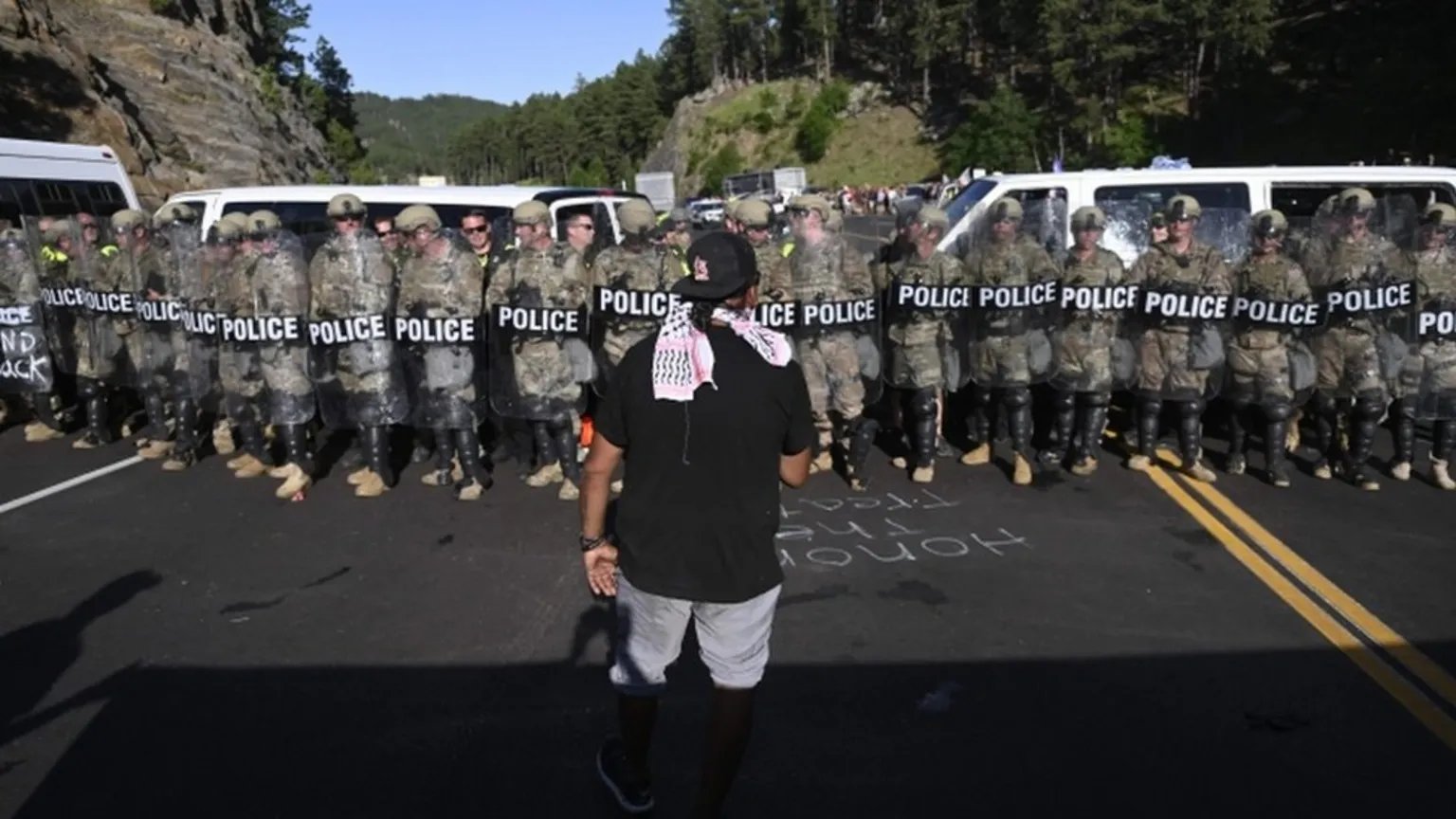 Protesters blockade main road to Mount Rushmore during Trump patriotic celebration